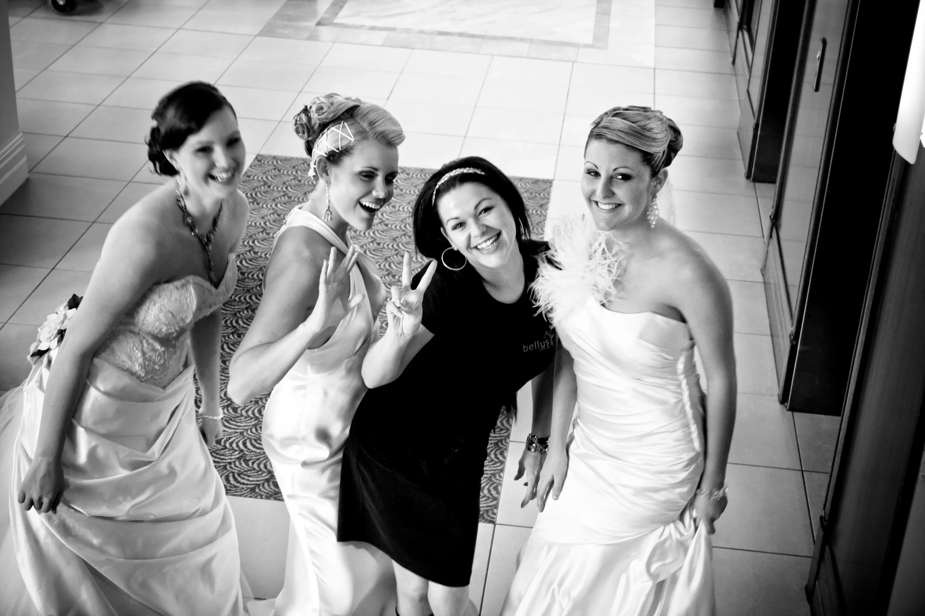 Amanda Frost with three brides, hair and makeup finished, before their wedding